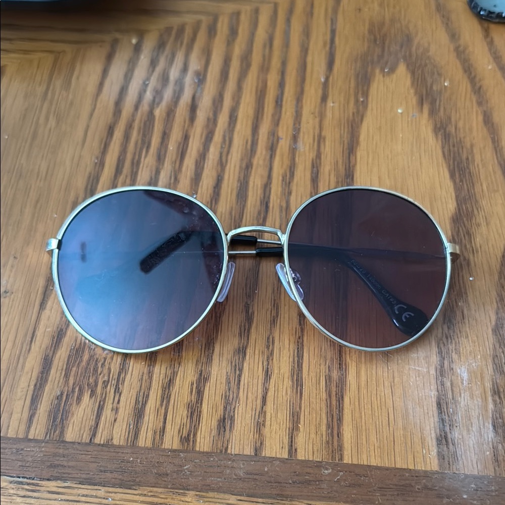 Round Gold Frame Sunglasses with Dark Lenses
